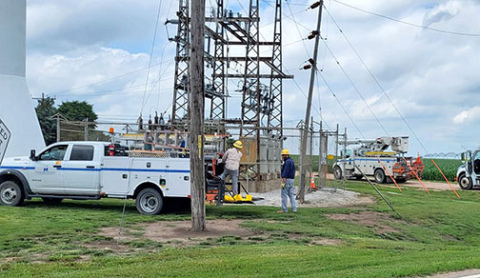 NPPD crews work at the Hampton substation near the water tower to restore electricity to village on Thursday afternoon. A broken insulator at the substation was blamed for the outage. 