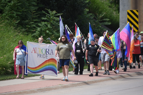  Aurora’s Pride crowd makes its way under the underpass near Refshauge Park during Saturday’s annual march.