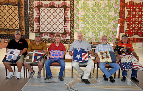 Six Aurora veterans receive their Quilts of Valor as a “thank you” for their service. From left to right: Darcy Greenough, Tanner Greenough, Jarod Greenough, Jeffrey Muilenburg, Jimmie Lyn Lewis Smith and John Tessman.