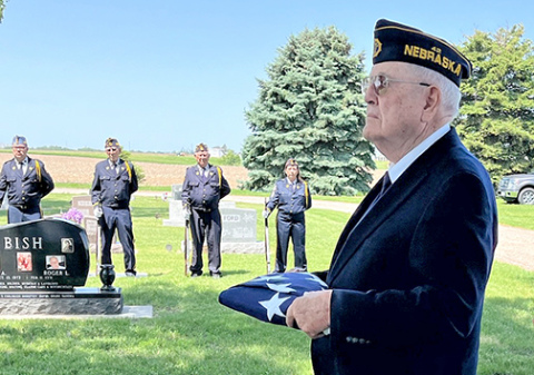 As a member of the American Legion color guard, Robert ‘Bob’ Leach, folded and presented dozens of American flags to family members of deceased veterans. In May he joined the color guard again to present a flag to the family of fellow veteran and long-time friend Richard ‘Dick’ Grosshans. 