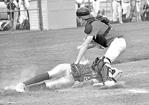 Aurora’s Dylan Ronnau slaps the tag on a Cozad baserunner for the game’s final out, sealing a 7-4 win Friday to open the B6 area tournament. 
