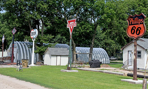 Some of Randy Beckman's oil company signs on his property in Marquette.