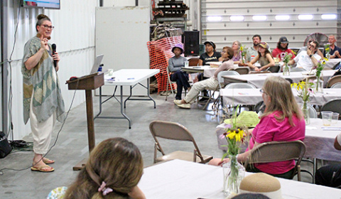 Amber Sciligo, director of science programs for the Organic Center headquartered in Washington, D.C. speaks to attendees at Grain Place Foundation’s annual Field Day near Marquette on July 13. 