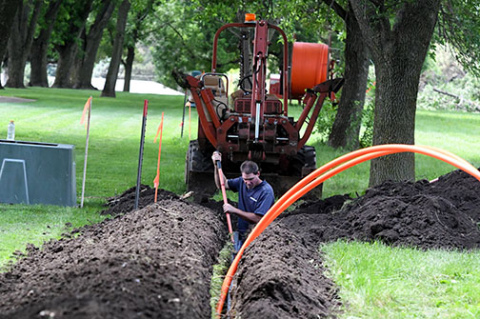 This ANR archive photo shows Hamilton crews burying a fiber cable near Poco Creek Golf Course as part of the company’s fiber-to-the-home initiative.
