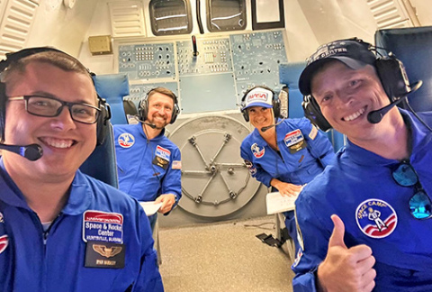 At the U.S. Space and Rocket Center, Scott Phillips and other Teachers of the Year, participated in simulated space missions. Pictured navigating the space shuttle as commander is Phillips (front right) assisted by his teammates Ryan Hardesty of Pennsylvania (front), Cory Hafer of Delaware and Aimée Couto of Rhode Island.