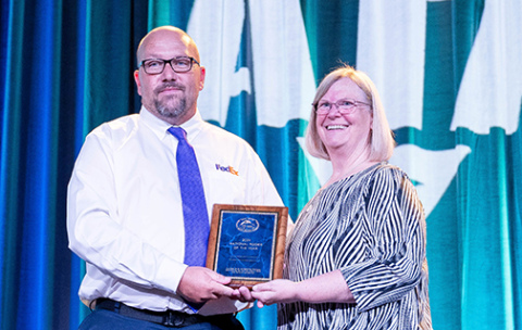 FedEx driver Todd Gimpel of Aurora is presented with a plaque proclaiming him as the National Trucking Associations’ Rookie of the Year in the twins class at the National Truck Driving Championships in Indianapolis, Ind. last month. Presenting the award is Patti Gillette, NTDC Chairman and director of safety and member services for the Nevada Trucking Association.