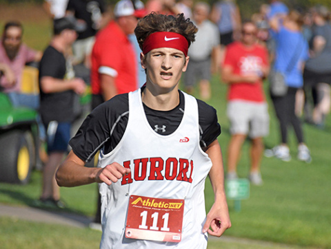Jayden Slagle finished sixth at the Aurora Invite with a time of 17:35, one of three medalists Friday for the Huskies. 