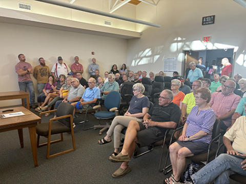 The council chambers at Aurora City Hall were overflowing with poeple during Thursday's 'pink postcard' public hearing regarding a proposed 38 percent property tax increase.