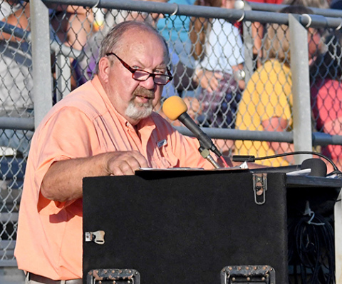Announcing at his last public event before retirement, the Voice of Hamilton County, Deryl Hilligas, speaks to the crowd at the NeFigure8n finals in August at the Hamilton County Fairgrounds. 