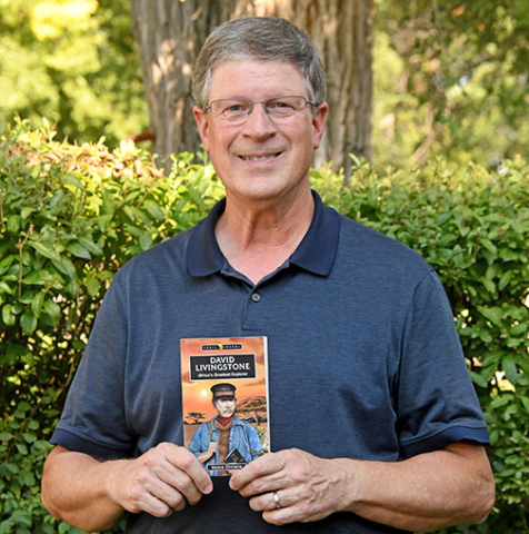 Vance Christie holds a copy of his latest book, “David Livingstone: Africa’s Greatest Explorer”, a biolgraphy of the famous African missionary/explorer for young adults, that will be released Sept. 11.