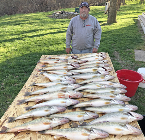 Gene Joseph displays a day’s catch on one of his many fishing trips to Lake Erie. He has been taking friends to an island near Port Clinton, Ohio, for the past 15 years.