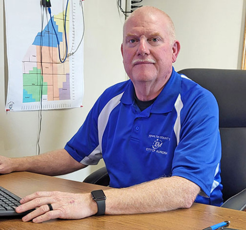 Outgoing Hamilton County Emergency Management Director Kirt Smith works at his desk at the Aurora Fire Station. 