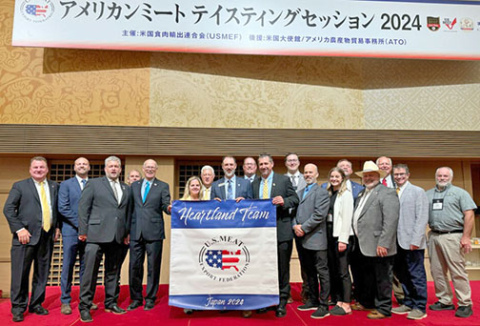 Hamilton County Corn Growers President Mike Bergen (center, behind banner) stands in Tokyo, Japan with the other members of the Heartland Team from USMEF that made a trade mission to the Asian nation in early September. 
