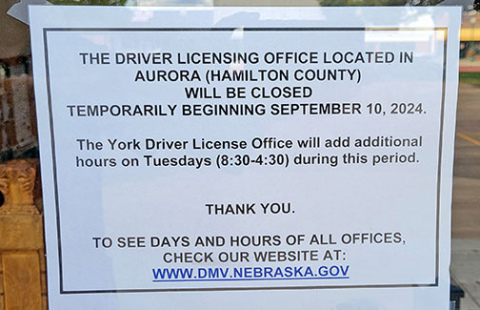 This sign sent by state DMV officials to be posted on the doors of the Hamilton County Courthouse just before the closure, was about the only notice county officials had that the office was being closed temporarily because the DMV was unhappy with the size of the room it had moved into earlier this summer. County officials are working with the Hamilton County Ag Society on a plan to move the facility to the 4-H building at the county fairgrounds. 