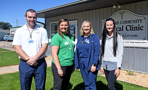 Pictured from left outside the Memorial Health Clinic in Harvard are Justin Wolf, MCHI CEO; Kachine Banahan, APRN, FNP-C; Logan Mertlik, PA-C; Brandi Nigro, MCHI clinic manager.