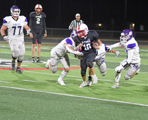 Aurora's Ian Jensen finds space during the Huskies' 56-14 win over Milford. Jensen scored three TDs, including the game's opening kickoff. 