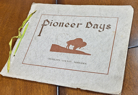 This commemorative booklet was published following the Pioneer Days celebration. It contains numerous photos of the parade floats and other entries as well as poems and readings that were delivered during the celebration. It concludes with a list of 362 people who registered at the 1924 event as original Hamilton County pioneers. To qualify for the list, individuals had to have been 21 years of age or older in 1884. 