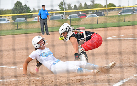 GICC’s game-winning run over Aurora was this close at the plate as the throw down to Londyn Teahon was just a bit late. The Crusaders escaped with a 9-8 win over the Huskies Monday in the opening round of the B-8 subdistrict tournament in York. 