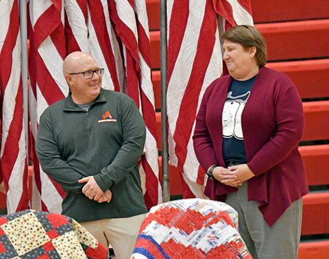 Aurora teachers Tim Elge (left) and Brenda Klawonn were both honored by the Aurora American Legion Post 42 Monday during a Veteran’s Day program for their efforts in the Heroes and Huskies project. 