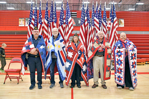 Five Aurora veterans received Quilt of Valor honors during Monday’s program at the school. Those include from left: Aaron Nilson, Roger Levering, Dana Kort, Gale Christenson and Priscilla Balasa. 