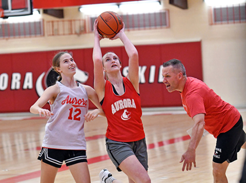 Aurora girls basketball players practice on Monday
