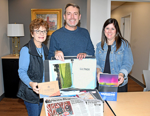 Members of the Hamilton Community Foundation board shown with a time capsule commemorating the organization’s 60th anniversary include, from left: Mary Mickey, Jeff Morris and April Mason.