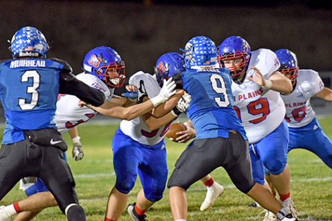 High Plains and Overton played physical Friday night with plenty of crashing hits and big plays. Above, HPC’s front line of Carter Urkoski (33), Caleb Sharman (90) and Kaden Rieken (90) setting up the run block.