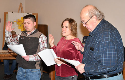 Newly-elected Aurora City Council members taking the oath of office Dec. 10 include, from left:  Mark Dunn, Esther Bergen and Wayne Roblee.