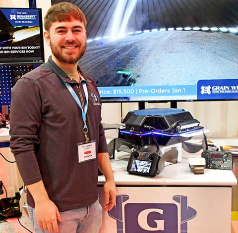 Grain Weevil inventor Ben Johnson stands next to the robot and accessories that will be available for pre-order to farmers beginning Jan. 1. 