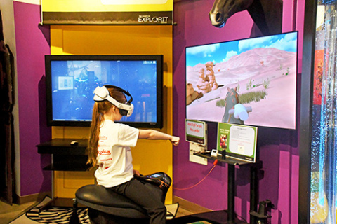 The Edgerton Explorit Center has brought together a horse riding simulator where visitors of all ages can saddle up and experience horseback riding in VR. While visiting the Edgerton on Friday, Dec. 17, Harvard third grader Vivian Kobza takes the reigns rides on the simulator.