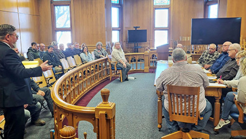 Attorney Stephen Mossman, left, addresses the Hamilton County Board of Commissioners Monday during a public hearing on a conditional use permit for S&P Irrigation. About 20 people attended the hearing, most of whom were in support of the permit. 