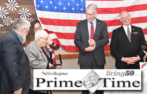 Lt. Gov. Joe Kelly (center) and others share a laugh after WWII medal recipient Carol Robotham cracks a joke related to her military service. 