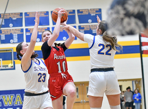 Kenna Merrihew looks for an inch of space to put up a midrange jumper. 