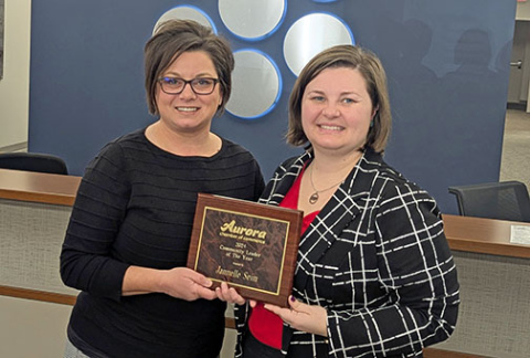 Jannelle Seim, pictured at left, was named Community Leader of the Year. Presenting the award is Chamber Executive Director Justise Rhoden. 