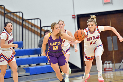 High Plains’ Emma Brown (14) slaps the basketball away from Hampton’s Khloe Luebbe during the first half of HPC’s 51-36 win in the CRC opening round Saturday. 