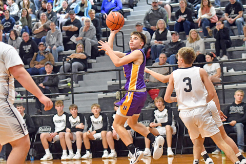 Landen Rojewski, shown here making a floater against Lawrence-Nelson Thursday, made a game-winning three-pointer against Meridian the following night. In all, the Hawk freshman scored 28 points between the two games. 