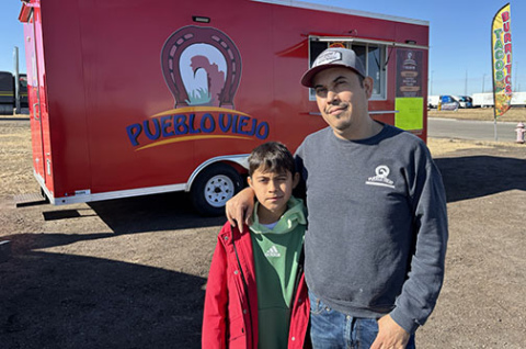 Antonio Sanchez and his son, Anthon, stand by the new Pueblo Viejo food truck at a site near the I-80/Highway 14 intersection.
