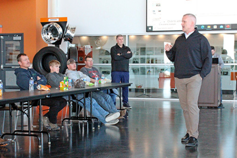 Timpte Trailers President and CEO Tim Carpenter, right, talks to members of the Hamilton County Corn Growers who attended a factory tour Thursday at the company’s David City plant where dry bulk semitrailers are built. 