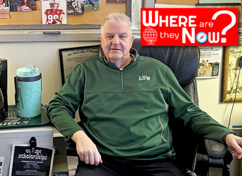 Tim Ernst sits in his guidance counselor office at Lincoln Southwest High School where he has created a bulletin board full of pictures of successful students he has worked with in the past.