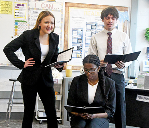 The Hampton OID team of (from left) Macy Miller, Taryn Stettner and Jameson Doyle perform at the Hampton Invite. 