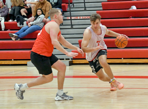 The Class of 2022/23’s Preston Ramaekers dribbles past 2018’s Ian Boerkircher during the 2024 Aurora alumni tournament final. 