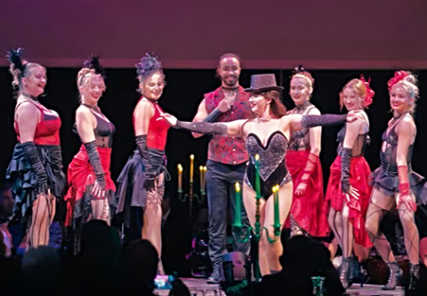 Performers at the Friends of the Lied Center for Performing Arts annual gala prepare to take their bows after performing on stage during the dinner. This year’s theme for the gala was Paris Lights. Deb Nelson of Aurora, who is the president elect of the organization, served as co-chair for the event.