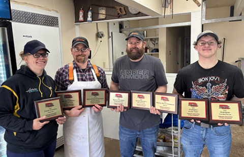 The Aurora Meat Block brought home eight honors from the Nebraska Association of Meat Processors convention in Kearney. Pictured from left are co-owners Andrea and Brent Winfield,  Josh Dick and Ed Van Landingham.