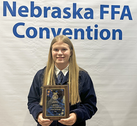 Morgan Bonifas displays the Nursery Operations Agricultural Proficiency Award she was presented at the Nebraska State FFA Convention earlier this month. She received the award for her high school summer job at Wild Roots Greenhouse in Central City. 