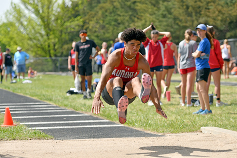 Aurora’s Vendell Juzyk won both the long and triple jumps for the Huskies during the Central Conference meet in York. 