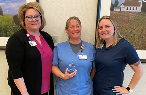 Aurora native Becky Graham, center, was named the first winner of what will be the annual Angel in Action Award at CHI Health St. Francis. Pictured with her are Kiley Grzywa, left, vice president of patient care services, and Sarah Williams, Inpatient Rehabilitation Unit manager.
