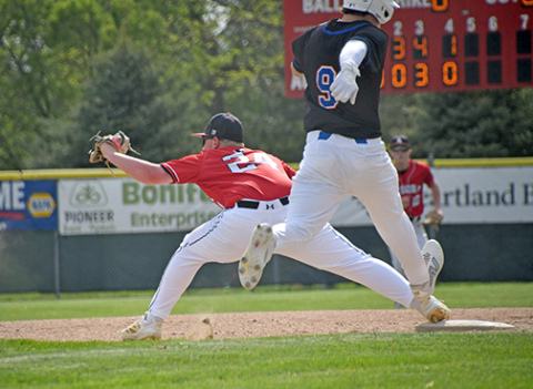 Tate Bendorf reaches out to get the out at first base for the Huskies during a 13-3 loss to St. Paul/Palmer at Mitchell field Thursday. Aurora will play Fort Calhoun to open up the C-4 district Thursday. 
