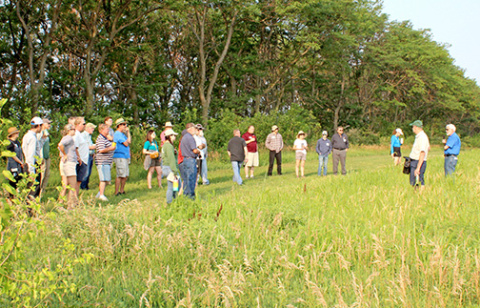 David Vetter (right), CEO of Grain Place Foods, leads visitors on a tour of the farm near Marquette during a previous field day. Morning farm tours will be also be a part of this year’s field day on July 12, but lunch and the afternoon session will be moved to The Leadership Center in Aurora for a presentation by Ray Archuleta, known nationally as “the Soil Guy,” and a screening of the film “Dreaming of a Vetter Life.” 