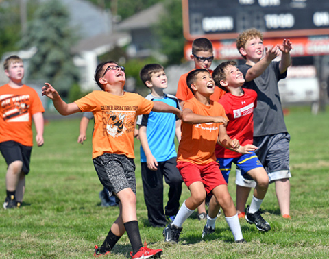 Kids having a ball at the Hoelck football camp in Giltner