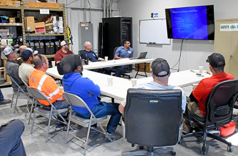 Members of local law enforcement, emergency service agencies and others participate in a public awareness and safety training exercise at the Koch Fertilizer anhydrous ammonia storage facility west of Aurora on Tuesday, June 10. Leading the session at top right is Facility Manager Tony Roth. 
